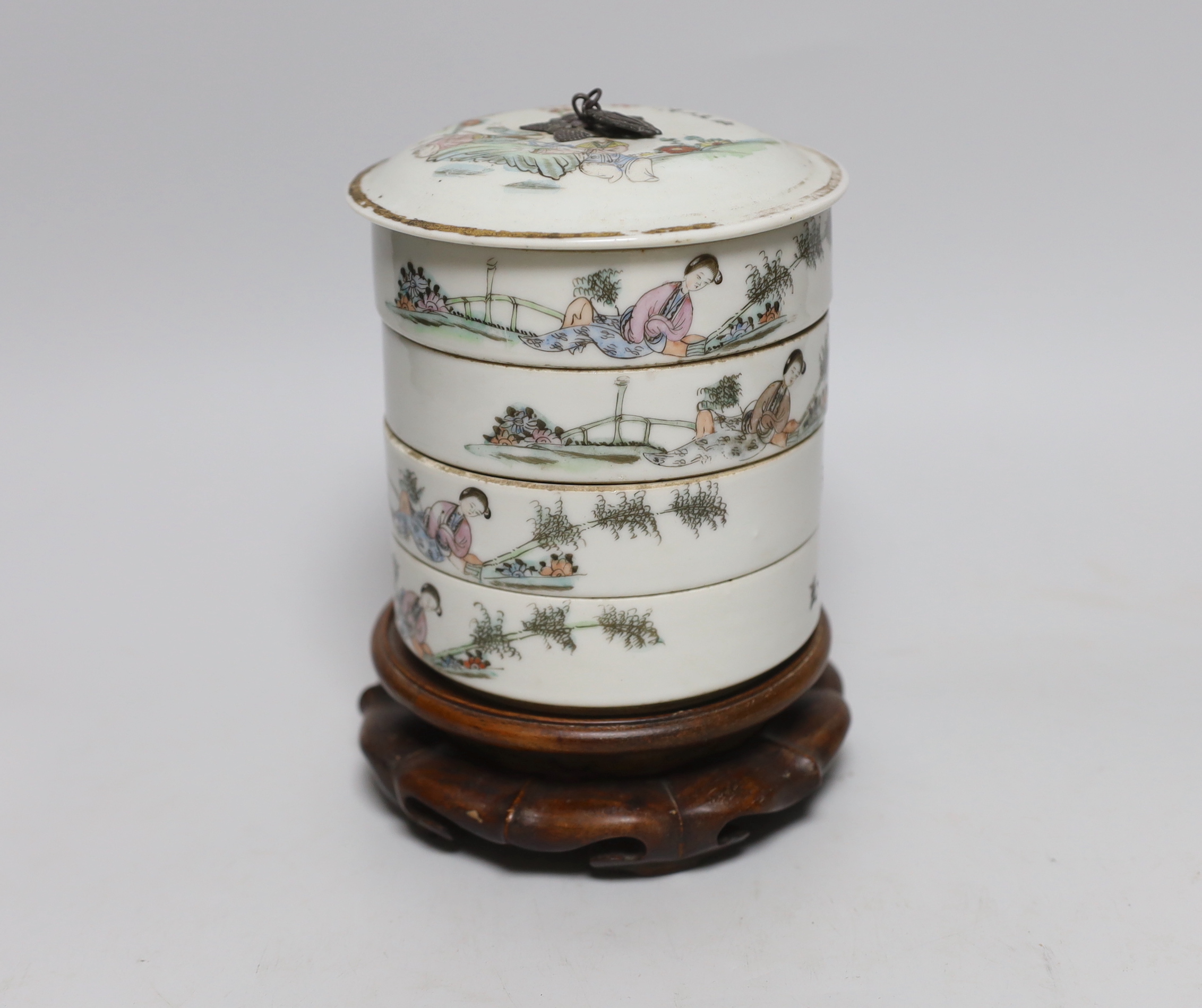 A set of early 20th century Chinese stacking containers on hardwood stand, 18cm